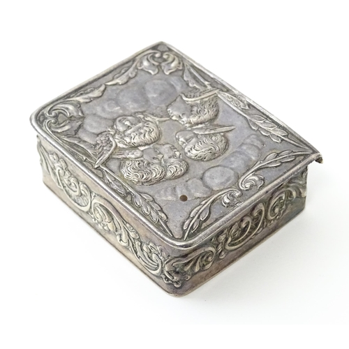 390 - A silver box of book form with embossed angel detail hallmarked Birmingham 1976, maker Richards & Kn... 