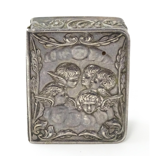 390 - A silver box of book form with embossed angel detail hallmarked Birmingham 1976, maker Richards & Kn... 