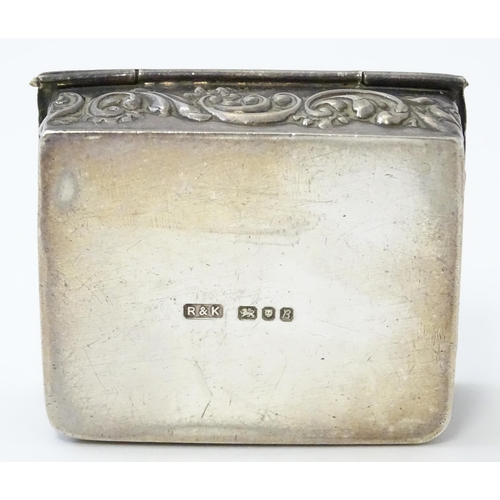 390 - A silver box of book form with embossed angel detail hallmarked Birmingham 1976, maker Richards & Kn... 