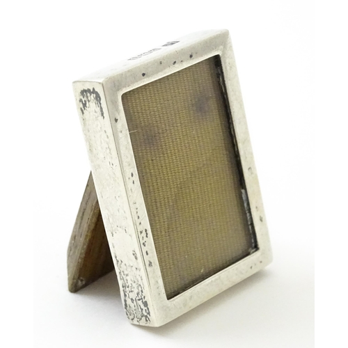 391 - A miniature easel back photograph frame with silver surround hallmarked Birmingham 1917, maker Lawre... 