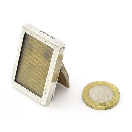 391 - A miniature easel back photograph frame with silver surround hallmarked Birmingham 1917, maker Lawre... 