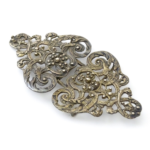 395 - A silver two sectional nurse's buckle with acanthus scroll and floral detail, hallmarked London 1975... 