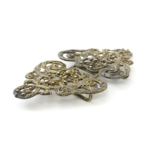 395 - A silver two sectional nurse's buckle with acanthus scroll and floral detail, hallmarked London 1975... 