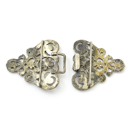 395 - A silver two sectional nurse's buckle with acanthus scroll and floral detail, hallmarked London 1975... 