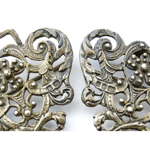 395 - A silver two sectional nurse's buckle with acanthus scroll and floral detail, hallmarked London 1975... 