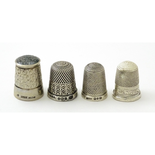 396 - Four assorted silver thimbles comprising one titled The Spa hallmarked Birmingham 1931, maker Henry ... 