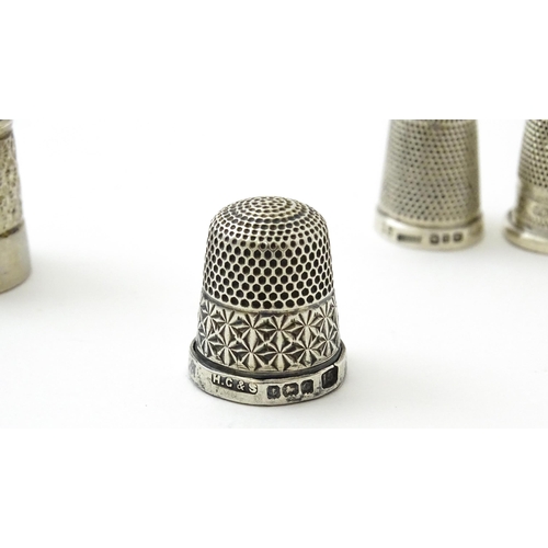 396 - Four assorted silver thimbles comprising one titled The Spa hallmarked Birmingham 1931, maker Henry ... 