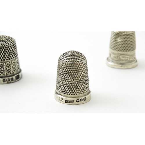 396 - Four assorted silver thimbles comprising one titled The Spa hallmarked Birmingham 1931, maker Henry ... 