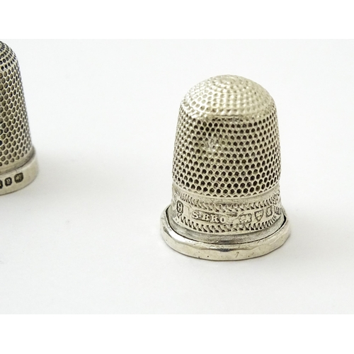 396 - Four assorted silver thimbles comprising one titled The Spa hallmarked Birmingham 1931, maker Henry ... 