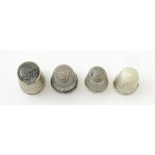 396 - Four assorted silver thimbles comprising one titled The Spa hallmarked Birmingham 1931, maker Henry ... 