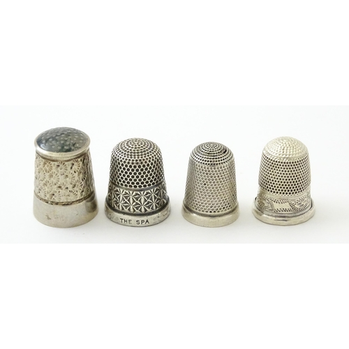 396 - Four assorted silver thimbles comprising one titled The Spa hallmarked Birmingham 1931, maker Henry ... 