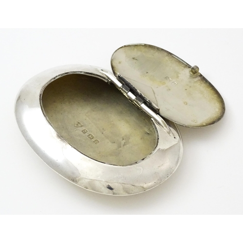 402 - A silver snuff / tobacco box of oval form hallmarked Birmingham 1905, maker Constantine & Floyd Ltd.... 