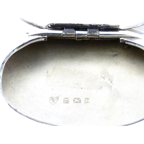 402 - A silver snuff / tobacco box of oval form hallmarked Birmingham 1905, maker Constantine & Floyd Ltd.... 