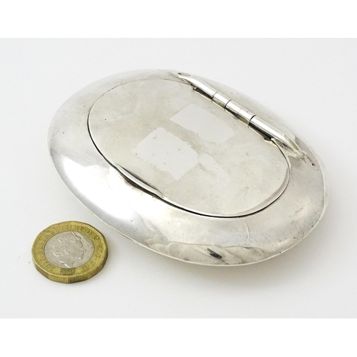 402 - A silver snuff / tobacco box of oval form hallmarked Birmingham 1905, maker Constantine & Floyd Ltd.... 