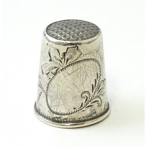 453 - A silver thimble hallmarked Chester 1919, maker Charles Horner. Together with a Continental silver t... 