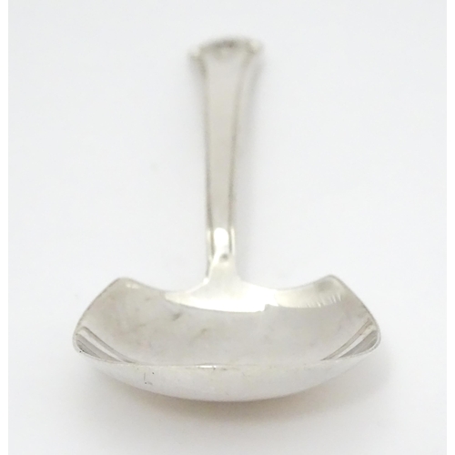 454 - A silver caddy spoon hallmarked Sheffield 1958, maker Cooper Brothers & Sons Ltd. Approx. 3 1/2