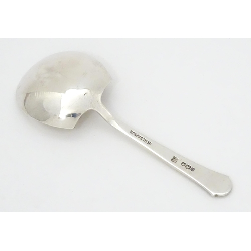 454 - A silver caddy spoon hallmarked Sheffield 1958, maker Cooper Brothers & Sons Ltd. Approx. 3 1/2