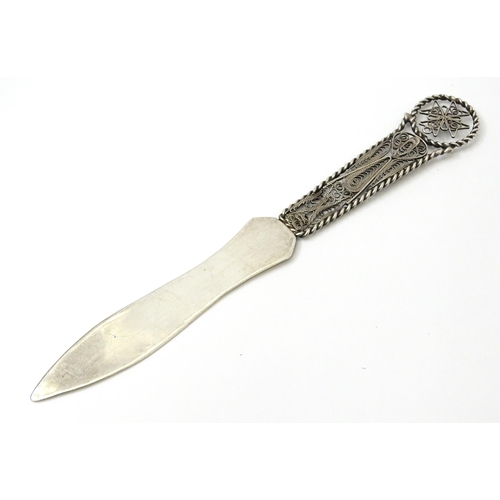 458 - A .925 silver letter opener, the handle with filigree detail with Maltese Cross decoration. Approx. ... 