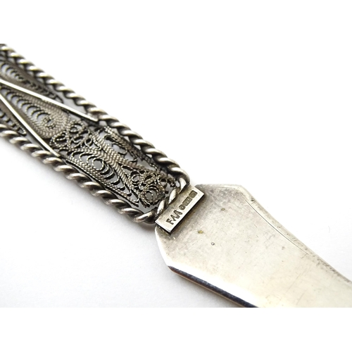 458 - A .925 silver letter opener, the handle with filigree detail with Maltese Cross decoration. Approx. ... 