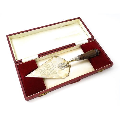 466 - A cased silver presentation trowel with engraved inscription 'Presented to Mr & Mrs A. W. Bennett on... 