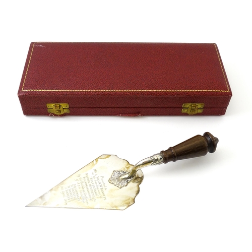 466 - A cased silver presentation trowel with engraved inscription 'Presented to Mr & Mrs A. W. Bennett on... 