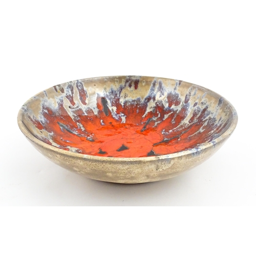 166 - A French Vallauris pottery bowl with Fat Lava style decoration. Marked under. Approx. 8