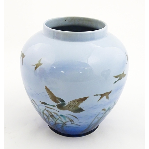 172 - A Falcon Ware vase decorated in the Misty Morn pattern depicting ducks in flight. Impressed Chang No... 