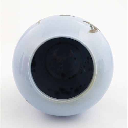 172 - A Falcon Ware vase decorated in the Misty Morn pattern depicting ducks in flight. Impressed Chang No... 