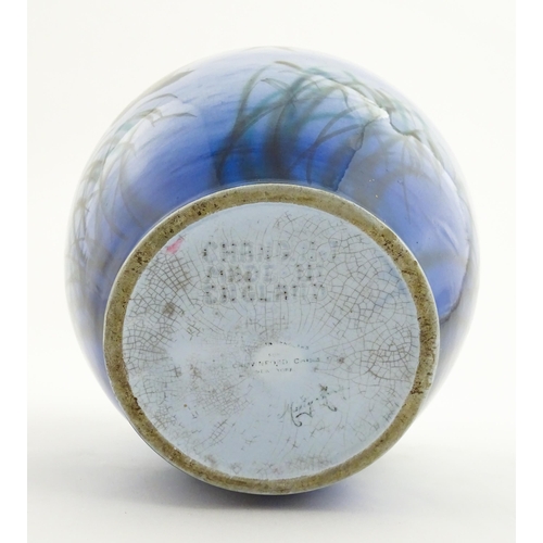 172 - A Falcon Ware vase decorated in the Misty Morn pattern depicting ducks in flight. Impressed Chang No... 