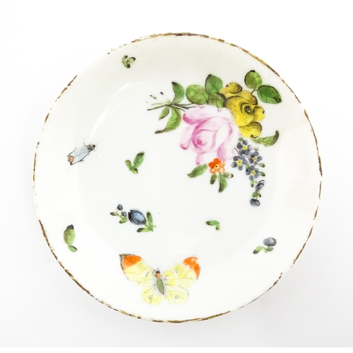 48 - Four Chinese items to include a tea bowl decorated with butterflies, a saucer with hand painted flor... 