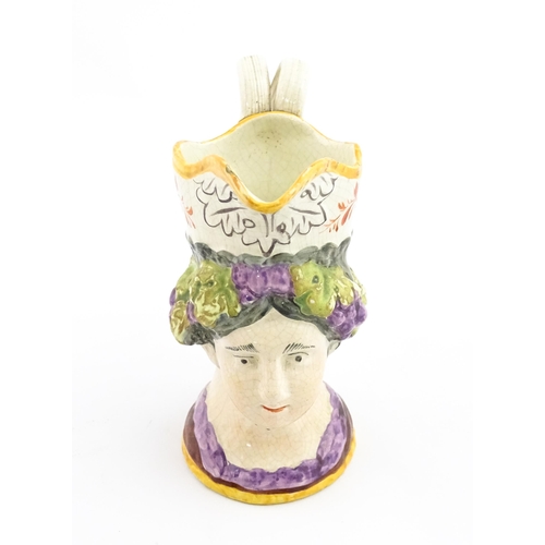 54 - A 19thC creamware mask jug depicting Princess Charlotte of Wales, made to commemorate her death in 1... 