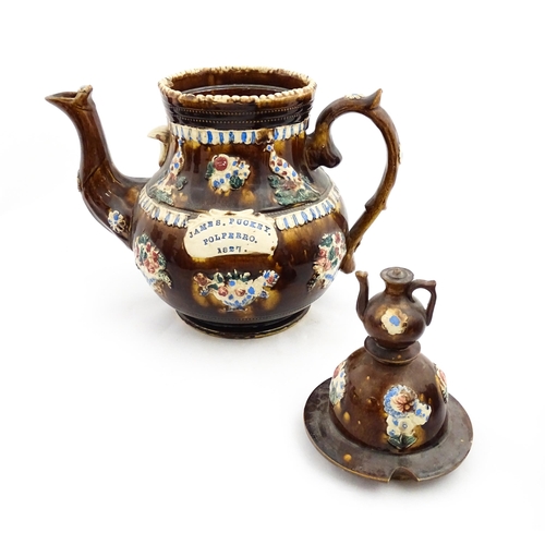 220 - A large 19thC Measham bargeware teapot bearing a plaque for James Puckey Polperro 1827, decorated wi... 