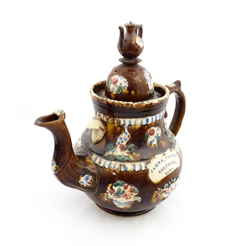 220 - A large 19thC Measham bargeware teapot bearing a plaque for James Puckey Polperro 1827, decorated wi... 