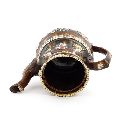 220 - A large 19thC Measham bargeware teapot bearing a plaque for James Puckey Polperro 1827, decorated wi... 