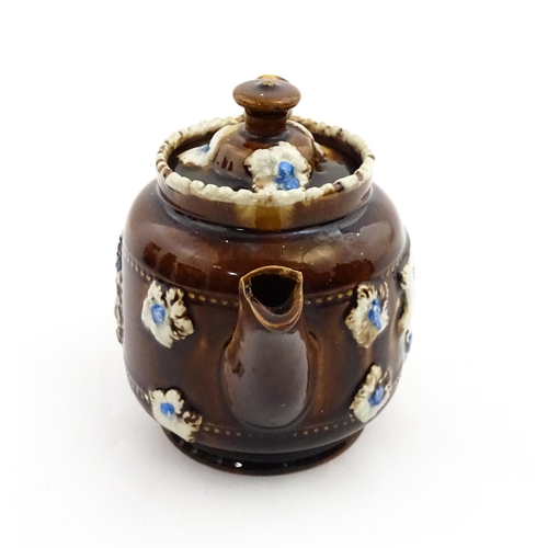 221 - A small Victorian Measham bargeware teapot bearing the motto Forget Me Not, with applied flower deta... 