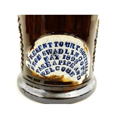 222 - A Victorian Measham bargeware tobacco pot and cover, bearing a plaque titled A Present to Mr T Sooth... 