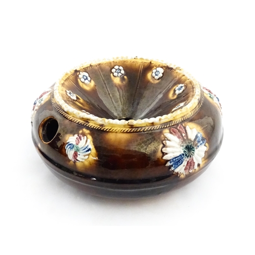 228 - A Victorian Measham bargeware spittoon / cuspidor with applied flower decoration. Approx. 7 1/2