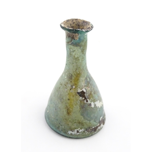 259 - A Roman glass flask of conical form with flared rim. Approx. 3 1/2