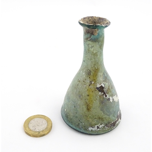 259 - A Roman glass flask of conical form with flared rim. Approx. 3 1/2