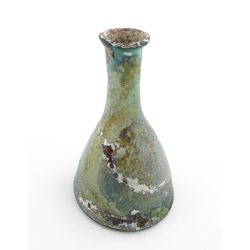 259 - A Roman glass flask of conical form with flared rim. Approx. 3 1/2