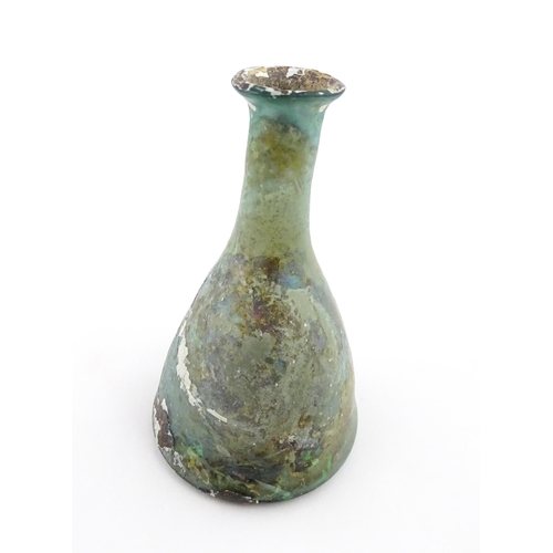 259 - A Roman glass flask of conical form with flared rim. Approx. 3 1/2