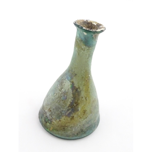 259 - A Roman glass flask of conical form with flared rim. Approx. 3 1/2