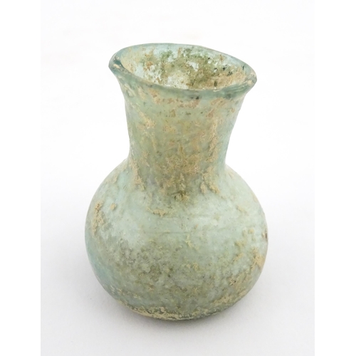 260 - A Roman glass flask with flared rim. Approx. 2