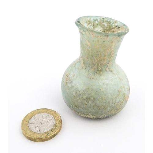 260 - A Roman glass flask with flared rim. Approx. 2