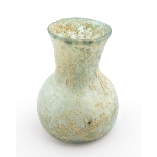 260 - A Roman glass flask with flared rim. Approx. 2