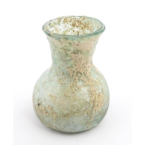 260 - A Roman glass flask with flared rim. Approx. 2