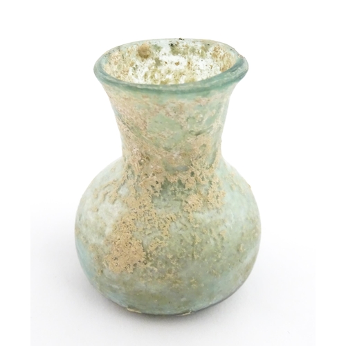 260 - A Roman glass flask with flared rim. Approx. 2