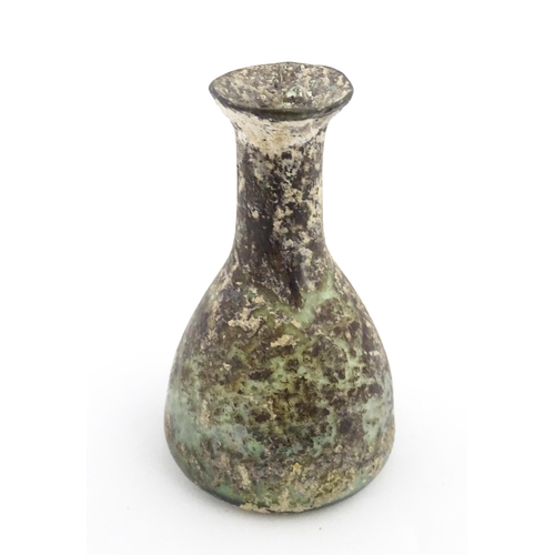 261 - A Roman glass flask with elongated neck and conical body. Approx. 2 3/4