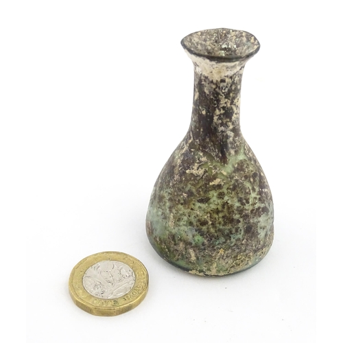 261 - A Roman glass flask with elongated neck and conical body. Approx. 2 3/4