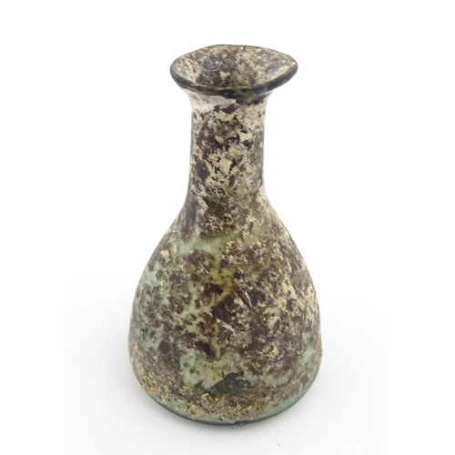 261 - A Roman glass flask with elongated neck and conical body. Approx. 2 3/4